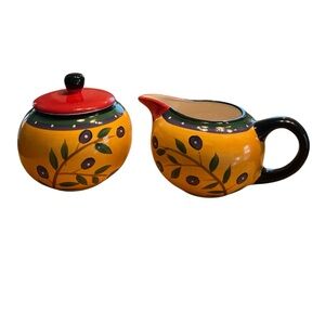 Dansk "Italian Garden" creamer and sugar bowl set features a vibrant yellow.